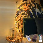 Decorative string lights on a wall with a remote control in the foreground.
