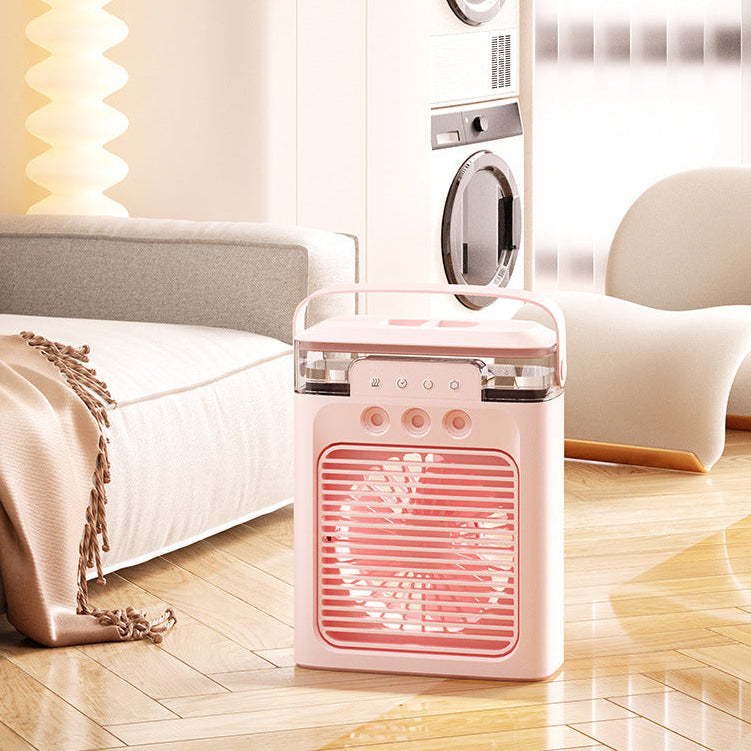 Pink portable heater on a wooden floor with a blurred background