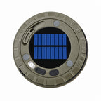 A circular solar-powered light or charging device with a blue solar panel in the center and a gray outer body, shown on a light gray background with Chinese promotional text above.