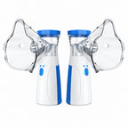 Two handheld nebulizer devices shown side by side on a white background, each with a clear face mask attached. The devices are white with blue accents and blue tops.