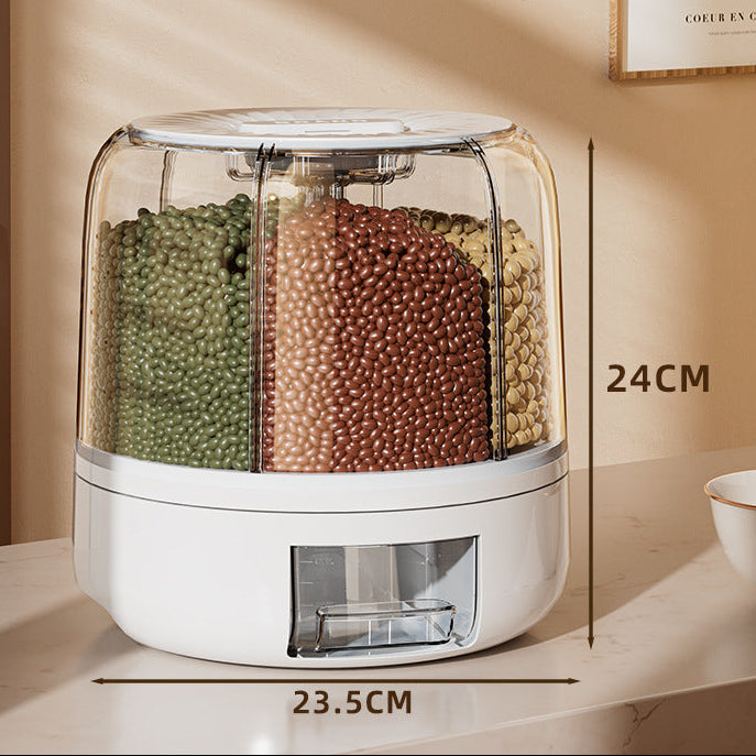 Food dispenser with compartments filled with green, brown, and beige beads on a marble surface.