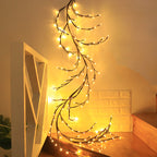 Decorative Willow string lights on a against a wall with a white shelf.