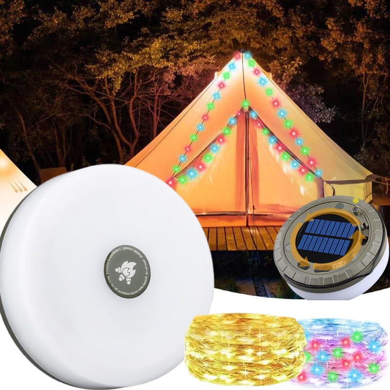 Solar LED string lights set with a white round controller, a solar panel charger, and coiled yellow, pink, and blue lights, shown with a camping tent lit at night in the background.