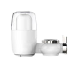 White and chrome bathroom faucet and dispenser on a white background