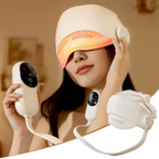 Woman wearing a white LED head massager device with a blurred indoor background